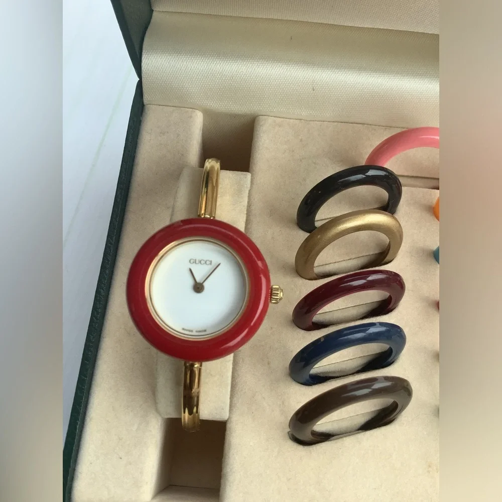 Gucci Women’s Gold Bangle Watch with Interchangeable Color Bezels